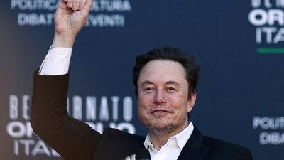Elon Musk gestures as he attends a political festival in Italy. (Reuters)