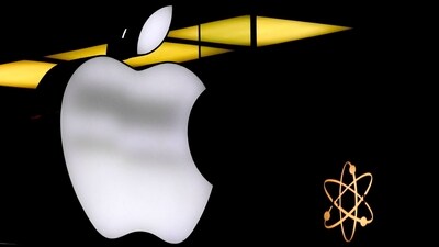 The Apple logo is illuminated at a store. (AP) The Apple logo is illuminated at a store. (AP)