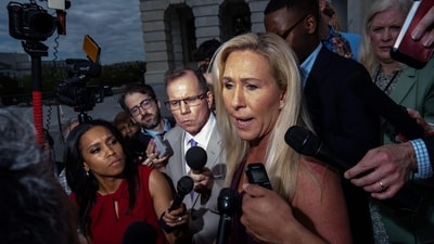 WASHINGTON, DC - APRIL 18: Rep. Marjorie Taylor Greene (R-GA) gaggles with reporters on the steps of the House of Representatives at the U.S. Capitol on April 18, 2024 in Washington, DC. Speaker Mike Johnson (R-LA) is pushing aid to Ukraine, Israel and Taiwan through the House over the objections of the right-flank of his own party. Kent Nishimura/Getty Images/AFP (Photo by Kent Nishimura / GETTY IMAGES NORTH AMERICA / Getty Images via AFP) (Getty Images via AFP) WASHINGTON, DC - APRIL 18: Rep. Marjorie Taylor Greene (R-GA) gaggles with reporters on the steps of the House of Representatives at the U.S. Capitol on April 18, 2024 in Washington, DC. Speaker Mike Johnson (R-LA) is pushing aid to Ukraine, Israel and Taiwan through the House over the objections of the right-flank of his own party. Kent Nishimura/Getty Images/AFP (Photo by Kent Nishimura / GETTY IMAGES NORTH AMERICA / Getty Images via AFP) (Getty Images via AFP)