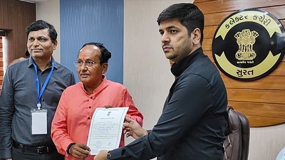 Surat: BJP leader Mukesh Dalal receives the 'certificate of election' after he was elected unopposed from Surat Lok Sabha seat, in Surat, Monday, April 22, 2024. (PTI)