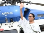 Chief minister of West Bengal, Mamata Banerjee waves towards TMC supporters during a campaign rally. (HT file photo)