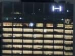 Lights on at HYBE office (L); ADOR CEO Min Hee-jin. Lights on at HYBE office (L); ADOR CEO Min Hee-jin.