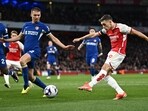 Arsenal's Leandro Trossard scores the first goal against Chelsea.