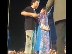Snapshot of the fan hugging Atif Aslam. Snapshot of the fan hugging Atif Aslam.