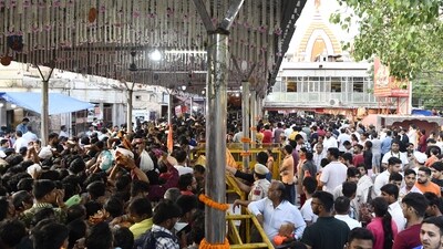 In the visuals, devotees were seen standing in the queue, waiting for their chance to offer prayers. (ANI)