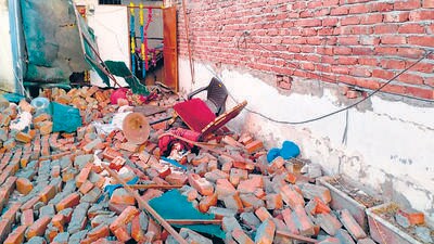 Debris litter the roof after the wall collapse on Tuesday. (HT Photo) Debris litter the roof after the wall collapse on Tuesday. (HT Photo)