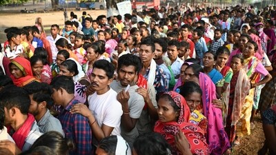 Voters queue up to cast their ballot outside a polling station during the first phase of voting of India's general election, in Dugeli village some 33 Km (21 miles) from Dantewada town in Chhattisgarh state on April 19, 2024. (Photo by Idrees MOHAMMED / AFP) / TO GO WITH 'India-vote-conflict-Maoist', FOCUS by Bhuvan Bagga (AFP) Voters queue up to cast their ballot outside a polling station during the first phase of voting of India's general election, in Dugeli village some 33 Km (21 miles) from Dantewada town in Chhattisgarh state on April 19, 2024. (Photo by Idrees MOHAMMED / AFP) / TO GO WITH 'India-vote-conflict-Maoist', FOCUS by Bhuvan Bagga (AFP)