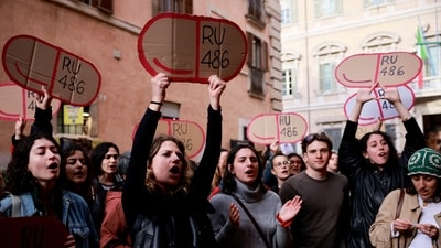 Women hold cardboard cutouts of RU-486 (abortion pill mifepristone) as they demonstrate outside Madama Palace (Senate) against a parliamentary amendment that could make it easier for anti-abortion groups to operate in publicly-run family clinics, in Rome, Italy, April 22, 2024. (Reuters)