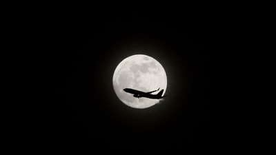 A plane passes by the almost full moon in Seattle, late Monday, April 22, 2024. The full moon, a so-called “pink” moon by The Old Farmer’s Almanac, after one of spring’s first wildflowers, will begin Tuesday night. (AP Photo/Manuel Valdes) (AP) A plane passes by the almost full moon in Seattle, late Monday, April 22, 2024. The full moon, a so-called “pink” moon by The Old Farmer’s Almanac, after one of spring’s first wildflowers, will begin Tuesday night. (AP Photo/Manuel Valdes) (AP)