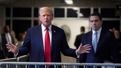 Former US President Donald Trump, with lawyer Todd Blanche (R), speaks to the press as he arrives at his trial for allegedly covering up hush money payments linked to extramarital affairs, at Manhattan Criminal Court in New York City on April 23, 2024. Trump faces a contempt of court hearing on Tuesday as part of his historic criminal trial, with New York prosecutors insisting the former president repeatedly violated the gag order issued to prevent him from intimidating witnesses. (Photo by TIMOTHY A. CLARY / POOL / AFP) (AFP)