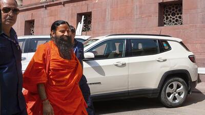 Yoga guru Ramdev at the Supreme Court for a hearing on the Patanjali misleading advertisements case on Tuesday. (PTI Photo) Yoga guru Ramdev at the Supreme Court for a hearing on the Patanjali misleading advertisements case on Tuesday. (PTI Photo)