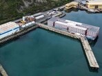 An aerial photograph taken on April 24, 2024 shows the Bibby Stockholm accommodation barge, moored to the quayside at Portland Port, in Portland, on the south-west coast of England. 