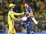 Lucknow Super Giants' Marcus Stoinis shakes hands with Chennai Super Kings' MS Dhoni (L) at the end of the Indian Premier League (IPL) match