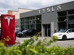 Cars are parked at a Tesla dealership in Berlin. Cars are parked at a Tesla dealership in Berlin.