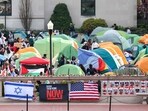 US flags alongside portraits of Israelis taken hostage by the militant Palestinian group Hamas in front of the pro-Palestinian encampment at Columbia University in New York on April 23, 2024. US flags alongside portraits of Israelis taken hostage by the militant Palestinian group Hamas in front of the pro-Palestinian encampment at Columbia University in New York on April 23, 2024.
