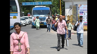 Hassled commuters after the Punjab Roadways union workers halted CTU buses in Phase 6, Mohali, on Wednesday morning. (Ravi Kumar/HT)