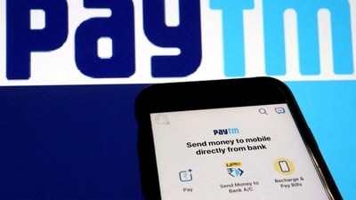 Paytm UPI handle: The interface of Indian payments app Paytm is seen in front of its logo displayed in this illustration picture. (Reuters)