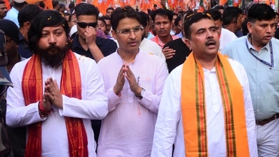 Siliguri: Union MoS for Youth Affairs and Sports Nisith Pramanik and Leader of the Opposition in West Bengal Assembly Suvendu Adhikari with BJP candidate from Darjeeling constituency Raju Bista during an election campaign for Lok Sabha polls, in Siliguri, Tuesday, April 23, 2024. (PTI) Siliguri: Union MoS for Youth Affairs and Sports Nisith Pramanik and Leader of the Opposition in West Bengal Assembly Suvendu Adhikari with BJP candidate from Darjeeling constituency Raju Bista during an election campaign for Lok Sabha polls, in Siliguri, Tuesday, April 23, 2024. (PTI)