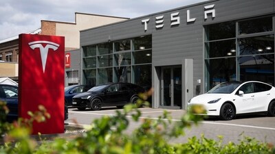 Cars are parked at a Tesla dealership in Berlin. (AP) Cars are parked at a Tesla dealership in Berlin. (AP)