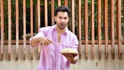 Varun Dhawan turned a year older on Wednesday. On the special occasion, Varun gave a sneak-peek into his intimate birthday celebration and shared a series of photos on his Instagram handle. The actor also posed for paparazzi holding a birthday cake. (Pic: Varinder Chawla) 