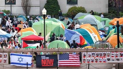 US flags alongside portraits of Israelis taken hostage by the militant Palestinian group Hamas in front of the pro-Palestinian encampment at Columbia University in New York on April 23, 2024. (AFP) US flags alongside portraits of Israelis taken hostage by the militant Palestinian group Hamas in front of the pro-Palestinian encampment at Columbia University in New York on April 23, 2024. (AFP)