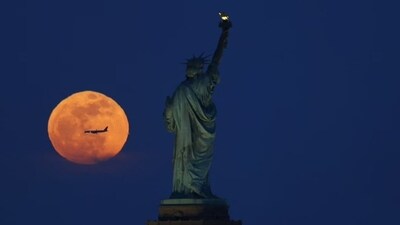 Pink Moon captured behind the Statue of Liberty in New York City. (X - @GaryHershorn) Pink Moon captured behind the Statue of Liberty in New York City. (X - @GaryHershorn)