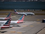 American Airlines planes at Terminal B of LaGuardia Airport (LGA) in the Queens borough of New York, US, on Sunday, April 7, 2024. American Airlines Group Inc. is expected to release earnings figures on April 25. Photographer: Angus Mordant/Bloomberg