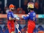 Royal Challengers Bangalore's Virat Kohli and Rajat Patidar celebrate their partnership during the match against Sunrisers Hyderabad 