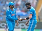 India's Hardik Pandya, right, hands the ball to captain Rohit Sharma during the ICC Men's Cricket World Cup last year. India's Hardik Pandya, right, hands the ball to captain Rohit Sharma during the ICC Men's Cricket World Cup last year.