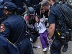 Pro-Palestinian protesters are pushed to the edge of campus at the University of Texas Wednesday, April 24, 2024, in Austin, Texas. Student protests over the Israel-Hamas war have popped up on an increasing number of college campuses following last week's arrest of more than 100 demonstrators at Columbia University. (Ricardo B. Brazziell/Austin American-Statesman via AP)(AP)