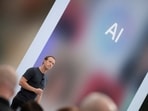 Meta CEO Mark Zuckerberg delivers a speech, as the letters AI for artificial intelligence appear on screen.