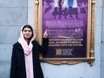 Malala Yousafzai pointing to a sign for her off-Broadway musical “Suffs” in New York. Malala Yousafzai pointing to a sign for her off-Broadway musical “Suffs” in New York.