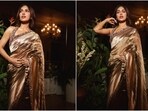 Bhumi Pednekar poses in a Manish Malhotra tissue silk saree and statement backless blouse. Bhumi Pednekar poses in a Manish Malhotra tissue silk saree and statement backless blouse.