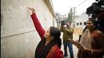 An enumerator staff marks a house during a caste-based census in Bihar in 2023. (HT Photo)