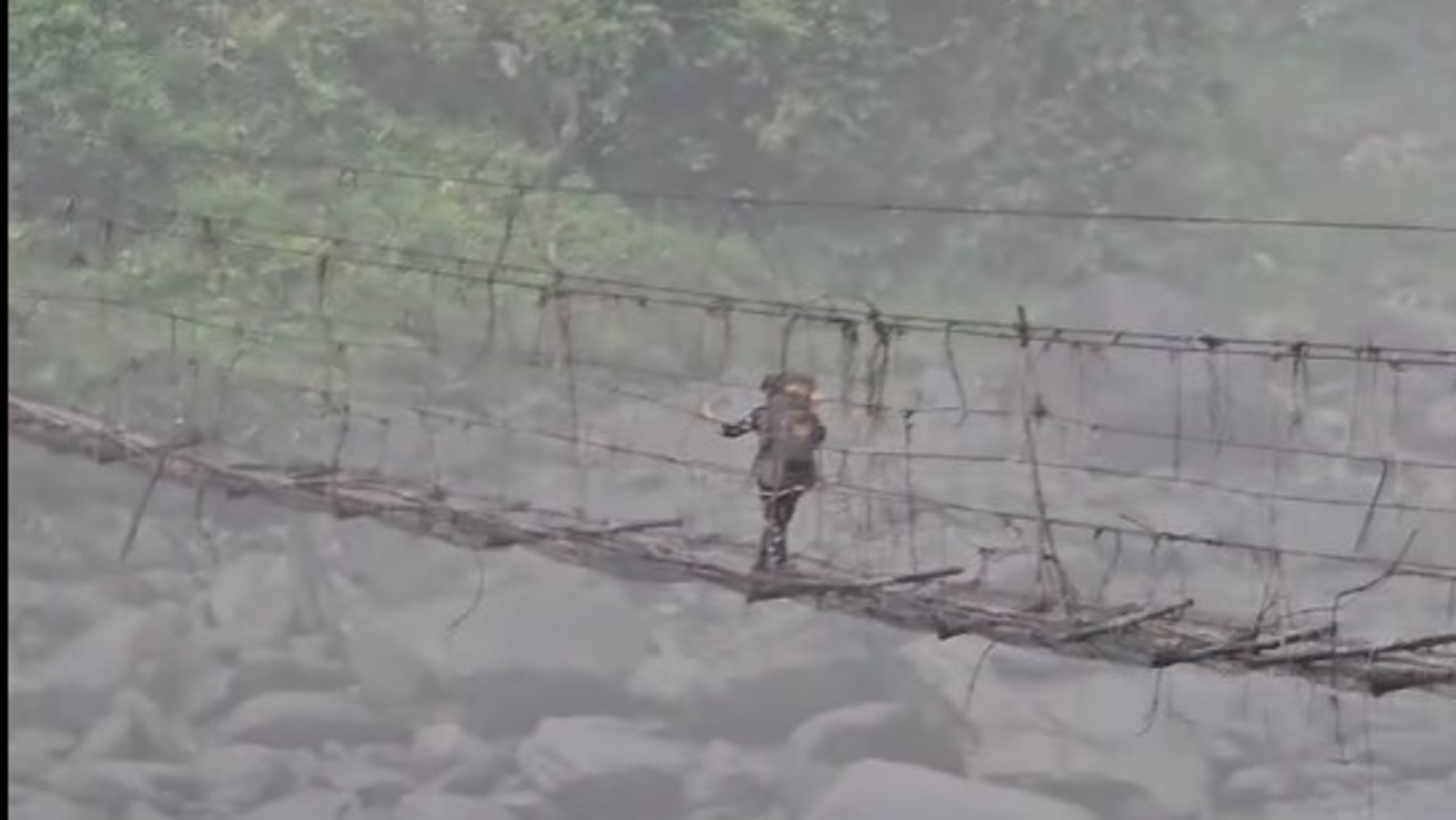 Police personnel cross dangerous, half-broken bamboo bridge after repolling in Arunachal Pradesh. Watch - Vimarsana News
