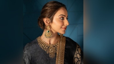 Assisted by celebrity fashion stylist Anshika Verma, Rakul accessorised her look with a pair of golden statement earrings studded with green emeralds and diamonds. With the help of hairstylist Aliya Shaik, she styled her voluminous locks into a middle-parted low bun. (Instagram/@rakulpreet) Assisted by celebrity fashion stylist Anshika Verma, Rakul accessorised her look with a pair of golden statement earrings studded with green emeralds and diamonds. With the help of hairstylist Aliya Shaik, she styled her voluminous locks into a middle-parted low bun. (Instagram/@rakulpreet)