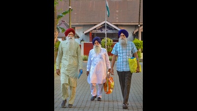 Amritpal’s father Tarsem Singh (red turban) coming out of Dibrugarh Central Jail after meeting ‘Waris Punjab De’ chief on Thursday. (PTI)