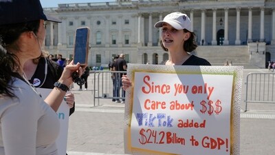 A TikTok content creator, speaks to reporters outside the U.S. Capitol, Tuesday, April 23, 2024, in Washington, as Senators prepare to consider legislation that would force TikTok's China-based parent company to sell the social media platform under the threat of a ban, a contentious move by U.S. lawmakers. (AP Photo/Mariam Zuhaib) (AP) A TikTok content creator, speaks to reporters outside the U.S. Capitol, Tuesday, April 23, 2024, in Washington, as Senators prepare to consider legislation that would force TikTok's China-based parent company to sell the social media platform under the threat of a ban, a contentious move by U.S. lawmakers. (AP Photo/Mariam Zuhaib) (AP)