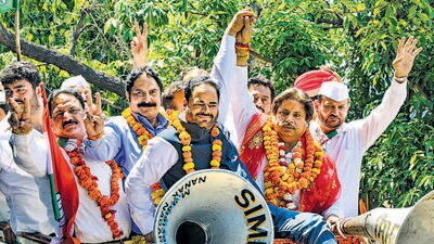 Congress candidate Raman Bhalla during a road show for Lok Sabha elections in Jammu. (PTI) Congress candidate Raman Bhalla during a road show for Lok Sabha elections in Jammu. (PTI)