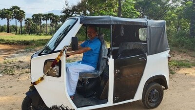 Zoho CEO Sridhar Vembu shows off his new electric three-wheeler.