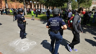USC public safety officers stand watch as demonstrators gather after students built a protest encampment in support of Palestinians at the University of Southern California's (USC) Alumni Park, during the ongoing conflict between Israel and the Palestinian Islamist group Hamas, in Los Angeles, California, U.S., April 24, 2024. REUTERS/David Swanson (REUTERS)