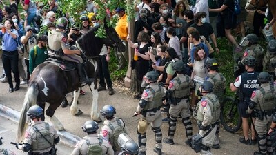 Pro-Palestinian protesters are pushed to the edge of campus by Texas State Troopers on horses at the University of Texas Wednesday, April 24, 2024, in Austin, Texas. (AP) Pro-Palestinian protesters are pushed to the edge of campus by Texas State Troopers on horses at the University of Texas Wednesday, April 24, 2024, in Austin, Texas. (AP)