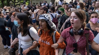 Demonstrators chant at a pro-Palestinian protest at the University of Texas Wednesday April 24, 2024 in Austin, Texas. Protests Wednesday on the campuses of at least two universities involved clashes with police, while another university shut down its campus for the rest of the week. (Mikala Compton/Austin American-Statesman via AP) (AP)