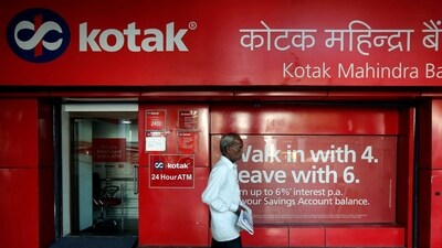 A man walks past the Kotak Mahindra Bank branch in New Delhi. (Reuters)