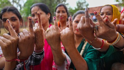 Women Voter show their ink marked fingers after casting votes at a polling station during the first phase of Lok Sabha polls. (PTI) Women Voter show their ink marked fingers after casting votes at a polling station during the first phase of Lok Sabha polls. (PTI)