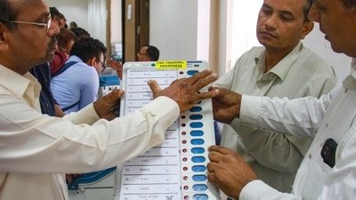 Polling officials during a training programme on the functioning of Electronic Voting Machine (EVM) (PTI) Polling officials during a training programme on the functioning of Electronic Voting Machine (EVM) (PTI)