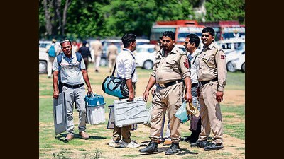 Polling officials collecting their EVMs and other material as they leave for their assigned booths on the eve of the second phase of Lok Sabha polls, in Jammu. (ANI) Polling officials collecting their EVMs and other material as they leave for their assigned booths on the eve of the second phase of Lok Sabha polls, in Jammu. (ANI)