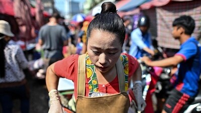 A vendor sweats from the heat as she pulls a cart at Khlong Toei Market, the biggest fresh market in Bangkok. (AFP) A vendor sweats from the heat as she pulls a cart at Khlong Toei Market, the biggest fresh market in Bangkok. (AFP)