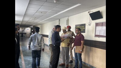 The AIG (in yellow T-shirt) was sent to two-day police remand by a Mohali court. (HT Photo) The AIG (in yellow T-shirt) was sent to two-day police remand by a Mohali court. (HT Photo)