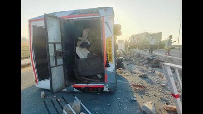 The Punjab Roadways bus landed on a side after it broke through the railings of an overpass following the collision with a tractor-trailer near Govindgarh village, 9km from Abohar, on Thursday morning. (HT Photo)